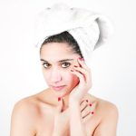 attractive-young-woman-with-her-white-wrapped-towel-head_23-2147901194