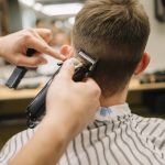 back-view-man-getting-haircut_23-2148506362