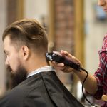 hairstylist-woman-doing-haircut_1163-2018