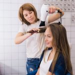 young-woman-getting-new-hairstyle-with-dryer-professional-hair-styling-saloon_231208-10835